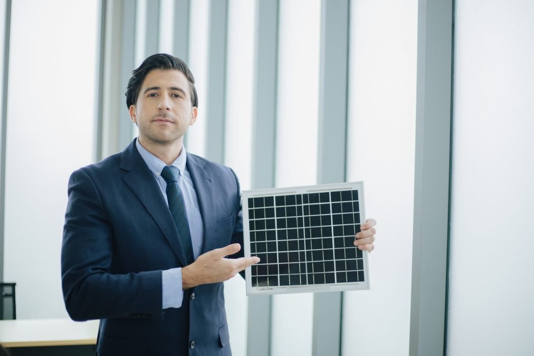 Business man present Solar Power Environment Concept